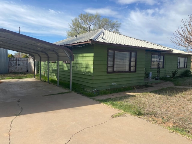 view of home's exterior featuring a carport