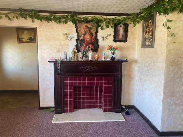 details featuring a tiled fireplace and carpet