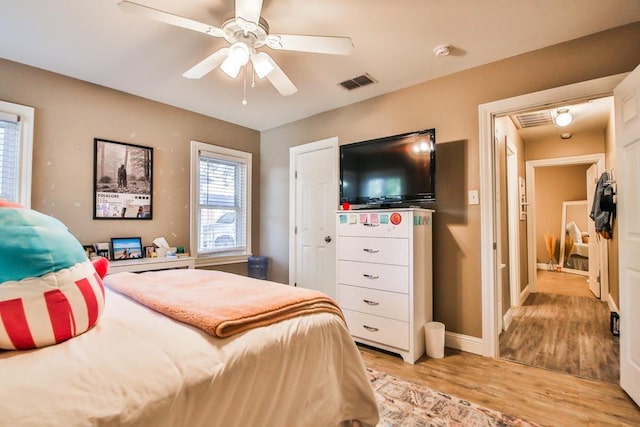 bedroom featuring ceiling fan and light hardwood / wood-style floors