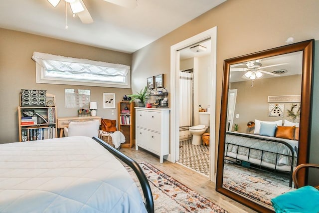 bedroom with ceiling fan, connected bathroom, and light hardwood / wood-style floors