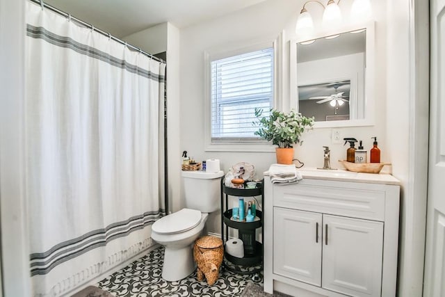 bathroom with vanity, curtained shower, and toilet