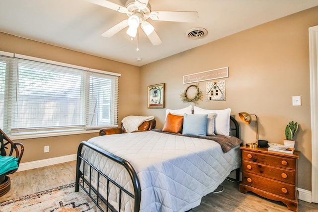 bedroom featuring hardwood / wood-style flooring and ceiling fan