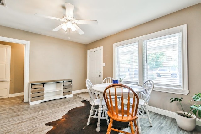 dining room featuring ceiling fan and light hardwood / wood-style floors