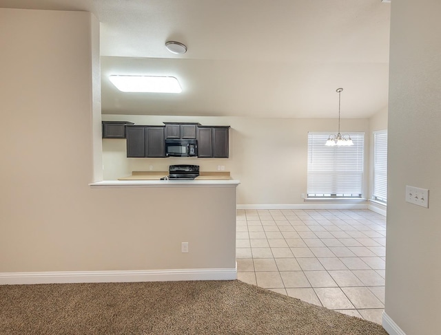 kitchen featuring electric range oven, light tile patterned flooring, vaulted ceiling, kitchen peninsula, and a chandelier