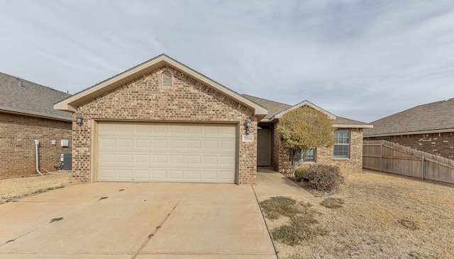 ranch-style home with a garage and central AC