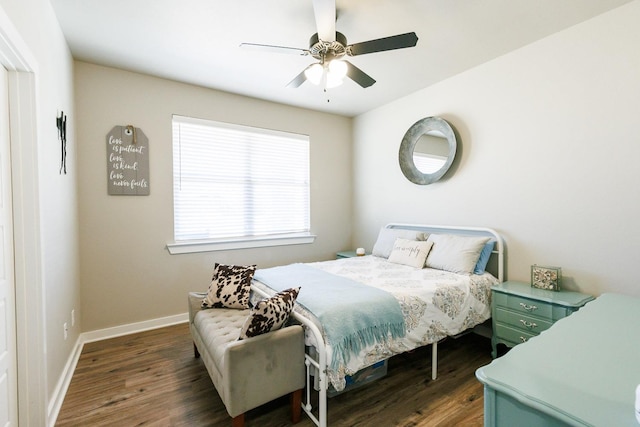 bedroom featuring dark hardwood / wood-style flooring and ceiling fan