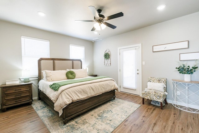 bedroom with hardwood / wood-style floors and ceiling fan