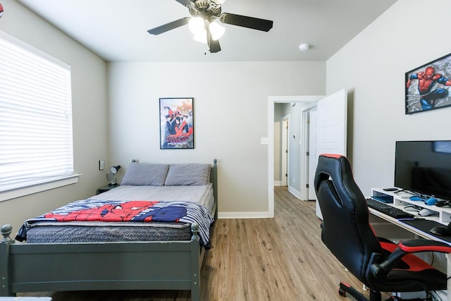 bedroom with hardwood / wood-style flooring and ceiling fan