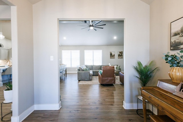 interior space featuring dark wood-type flooring, sink, and ceiling fan