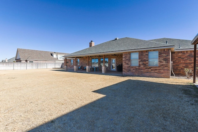 rear view of house featuring a patio