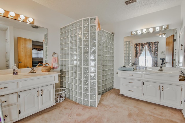 bathroom with vanity and a textured ceiling