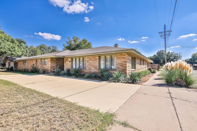 ranch-style house with a front lawn