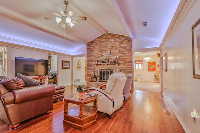 living room with vaulted ceiling with beams, ceiling fan, a fireplace, and light wood-type flooring