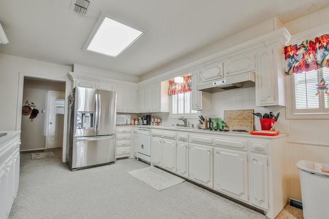 kitchen featuring white cabinetry, sink, white appliances, and decorative backsplash