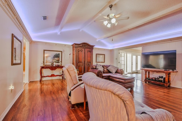 living room with ceiling fan, wood-type flooring, and lofted ceiling with beams