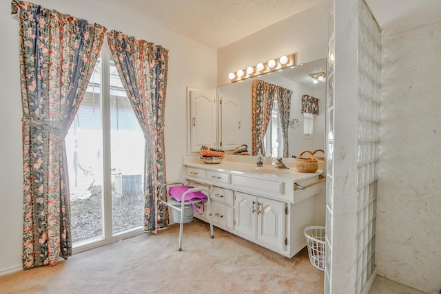 bathroom with vanity and a textured ceiling