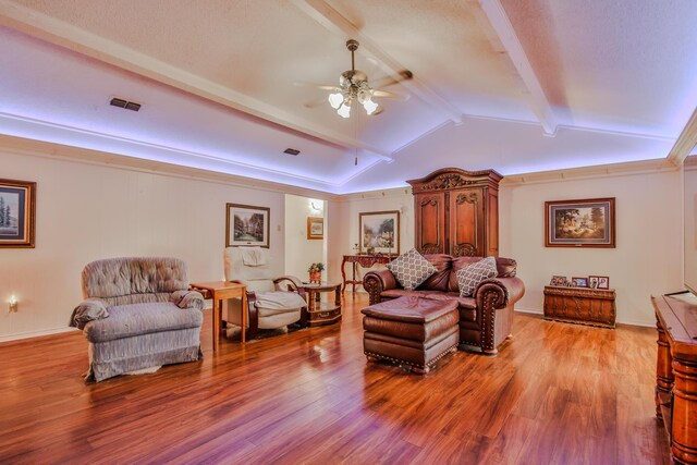 interior space featuring lofted ceiling with beams, a textured ceiling, ceiling fan, and light hardwood / wood-style flooring