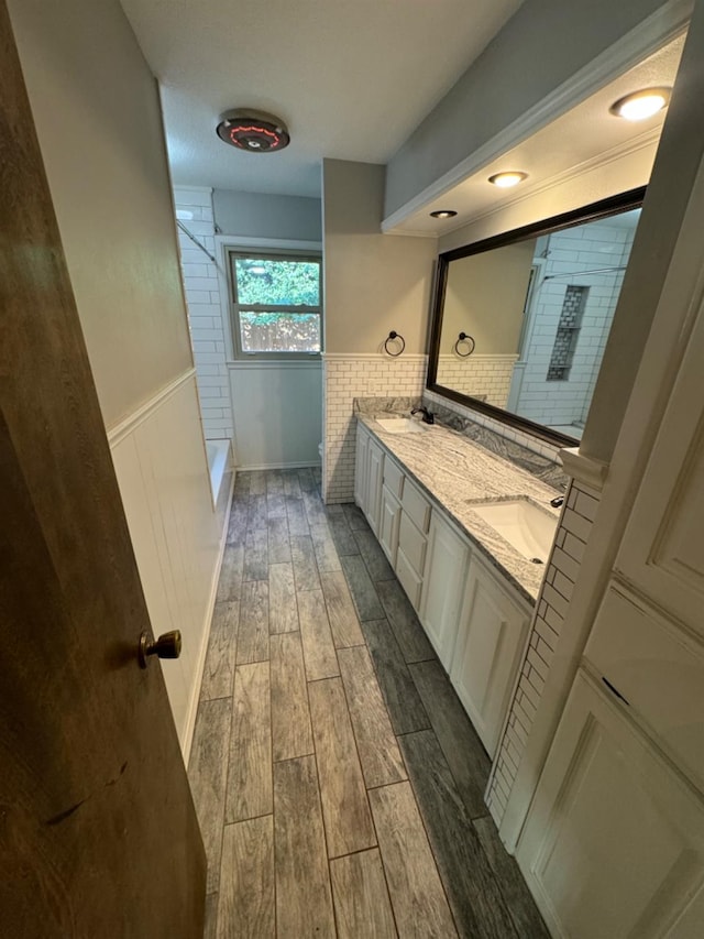 bathroom featuring vanity and a shower