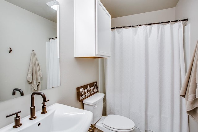 bathroom with toilet and sink