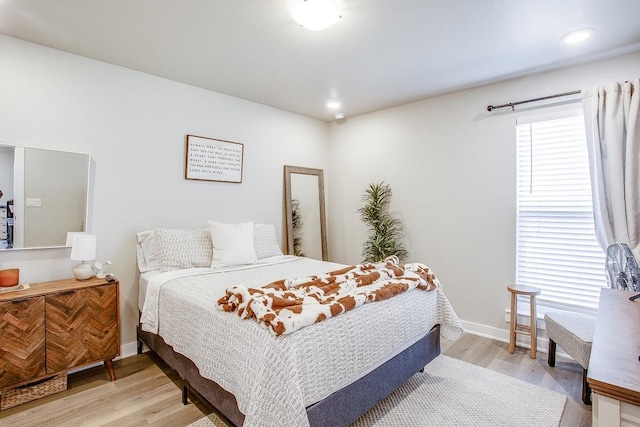 bedroom with light hardwood / wood-style floors