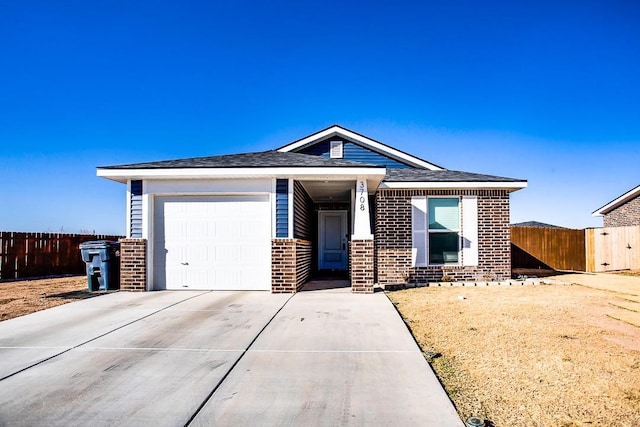 view of front of property with a garage