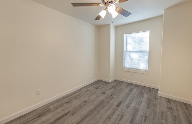 unfurnished room with light hardwood / wood-style flooring and ceiling fan