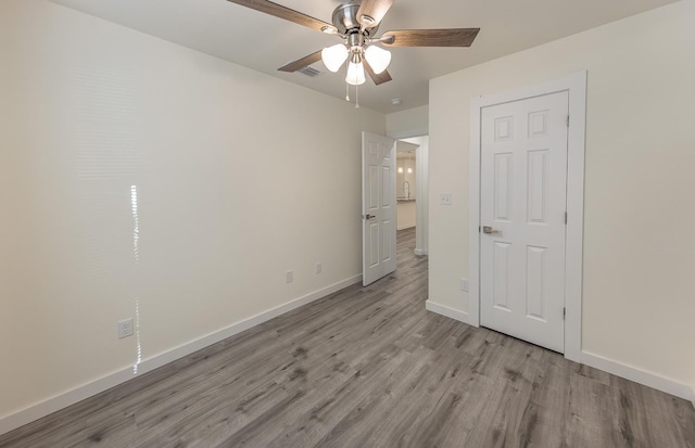 unfurnished bedroom featuring ceiling fan and light hardwood / wood-style flooring