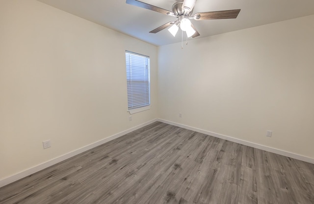 spare room with ceiling fan and light hardwood / wood-style flooring