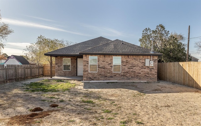 back of property with a patio