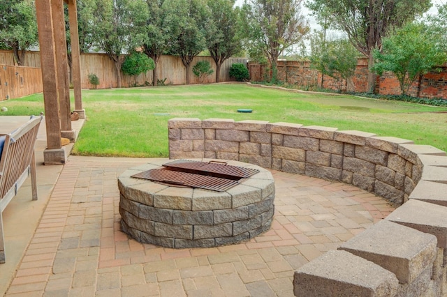 view of patio / terrace featuring an outdoor fire pit