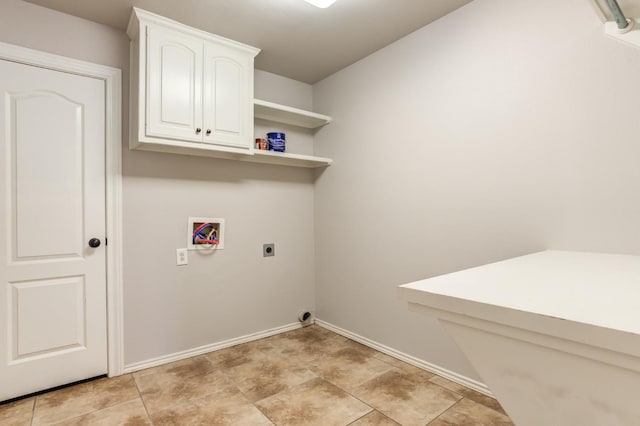 washroom with washer hookup, cabinets, and hookup for an electric dryer