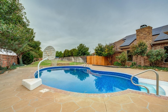 view of swimming pool featuring a patio