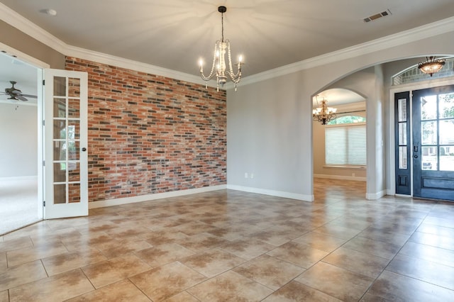 interior space with crown molding, brick wall, light tile patterned flooring, and ceiling fan with notable chandelier