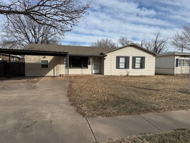 single story home featuring a carport