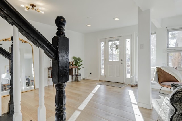 entryway with light hardwood / wood-style flooring and plenty of natural light