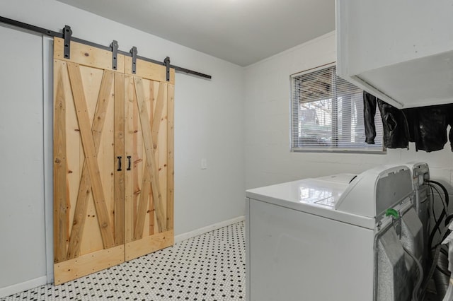 laundry room featuring washer / dryer and a barn door