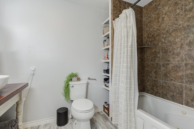 bathroom featuring hardwood / wood-style flooring, toilet, and shower / bath combo with shower curtain