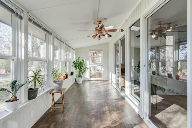 sunroom / solarium featuring ceiling fan and vaulted ceiling