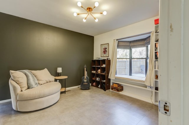 sitting room featuring a notable chandelier