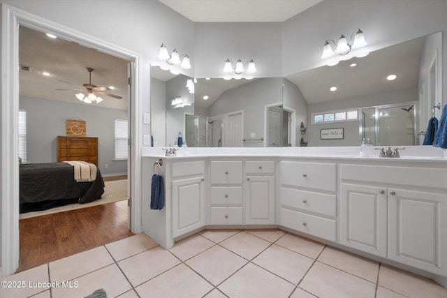 10401 Elgin Ave, Lubbock, TX 79423 - ensuite bathroom featuring double vanity, a stall shower, ceiling fan, tile patterned floors, and recessed lighting
