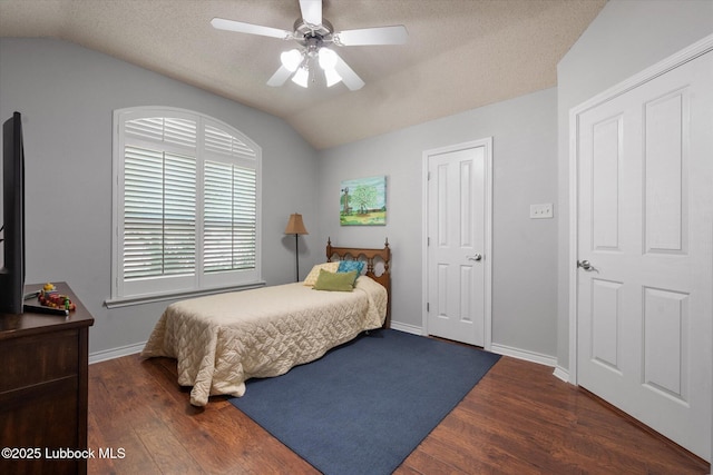 10401 Elgin Ave, Lubbock, TX 79423 - bedroom with vaulted ceiling, wood finished floors, ceiling fan, and a textured ceiling