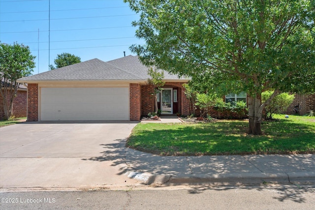 10401 Elgin Ave, Lubbock, TX 79423 - view of front of home with an attached garage, a front yard, driveway, and brick siding