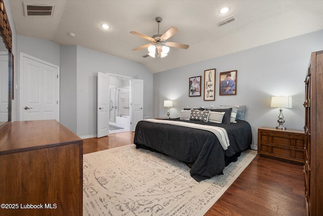 10401 Elgin Ave, Lubbock, TX 79423 - bedroom featuring vaulted ceiling, dark wood-style flooring, ensuite bath, recessed lighting, and ceiling fan