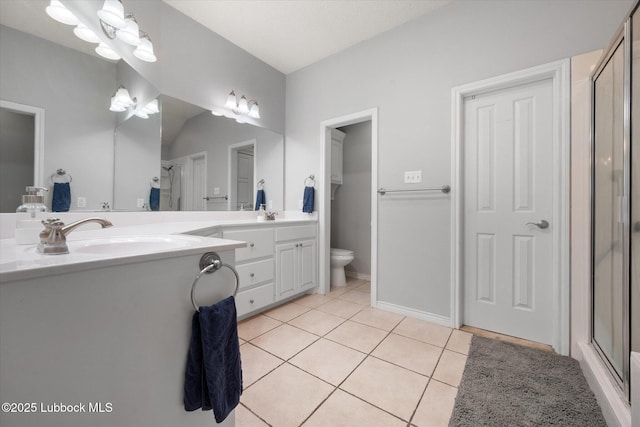 10401 Elgin Ave, Lubbock, TX 79423 - bathroom featuring tile patterned floors, double vanity, and a stall shower