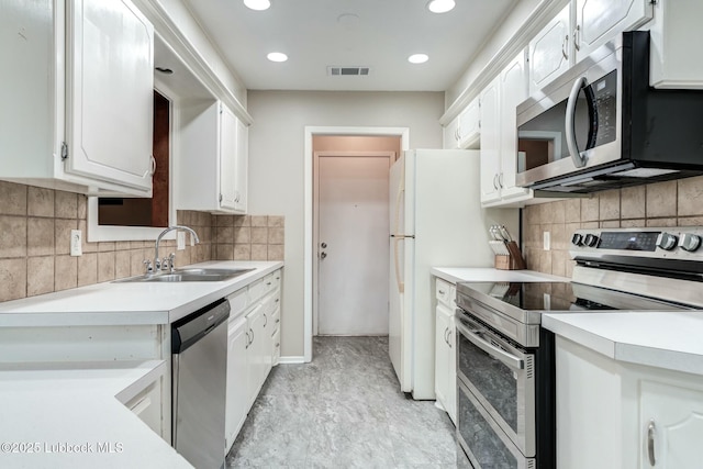5734 92nd St, Lubbock, TX 79424 - kitchen with white cabinets, a sink, light countertops, stainless steel appliances, and visible vents