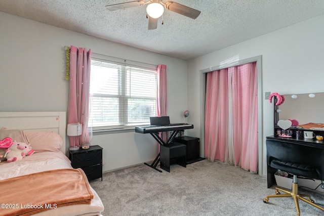 5734 92nd St, Lubbock, TX 79424 - bedroom featuring ceiling fan, a textured ceiling, and light colored carpet