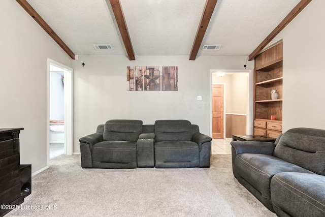 5734 92nd St, Lubbock, TX 79424 - carpeted living room with a textured ceiling, visible vents, and lofted ceiling with beams