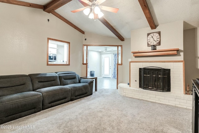 5734 92nd St, Lubbock, TX 79424 - carpeted living area with a fireplace, lofted ceiling with beams, a ceiling fan, and a textured ceiling