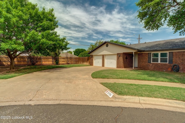 5734 92nd St, Lubbock, TX 79424 - ranch-style house with brick siding, a front lawn, fence, and driveway