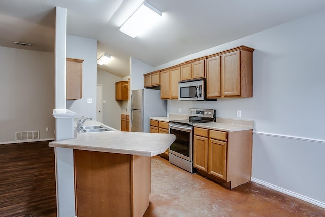 kitchen featuring concrete flooring, appliances with stainless steel finishes, lofted ceiling, sink, and kitchen peninsula